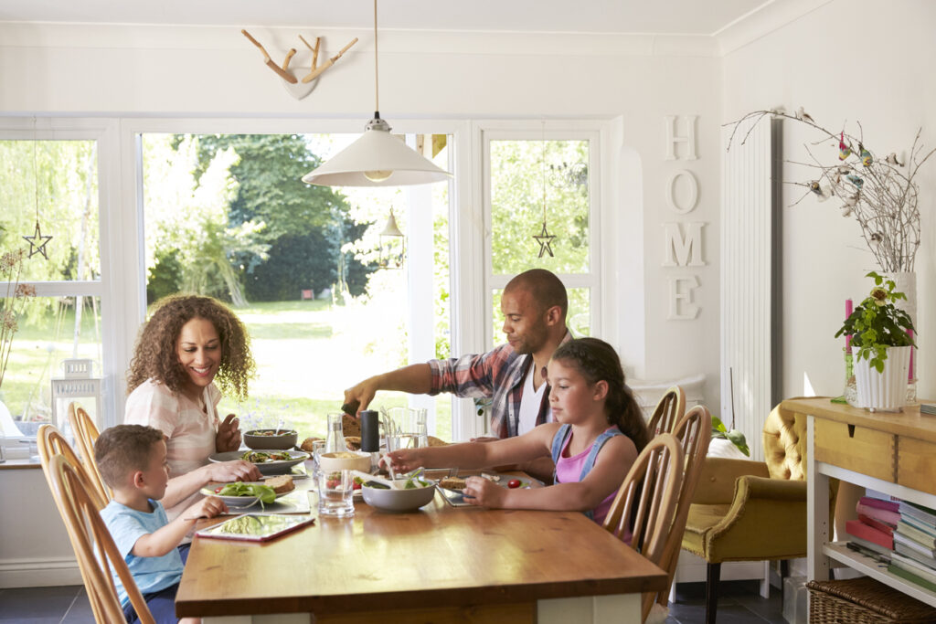 a family talks at dinner about how the recent move had affected them