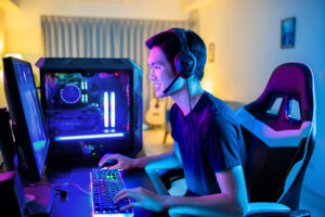 teen boy playing computer video games
